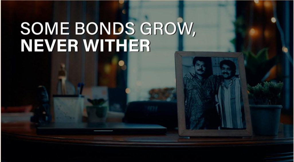 A framed photograph on a table with the line: some bonds grow, never wither